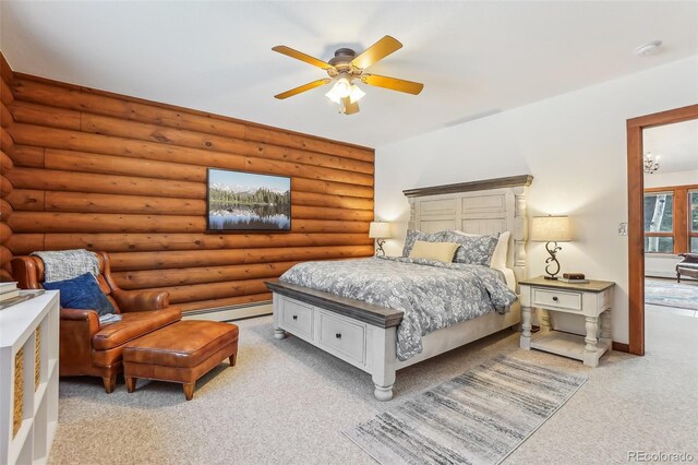 bedroom with a baseboard heating unit, light carpet, and a ceiling fan