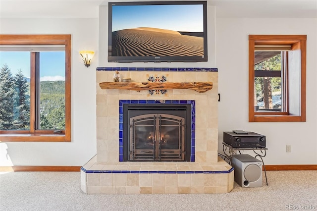 details with carpet, a fireplace, and baseboards