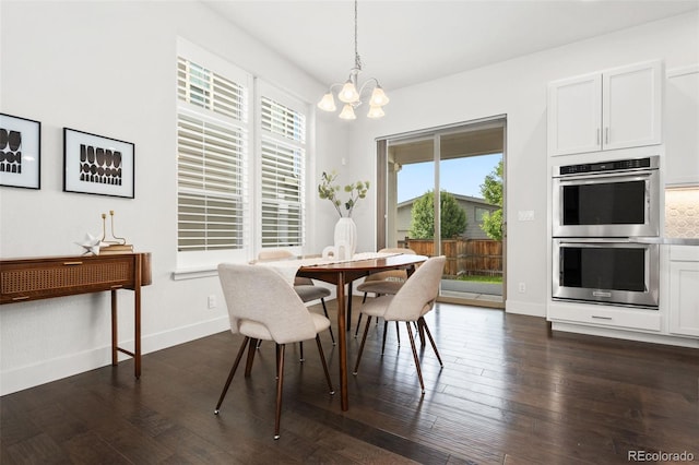10295 E 59th Ave, Denver, CO 80238 - dining space featuring a chandelier, plenty of natural light, and dark wood-style floors