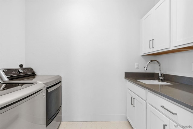 10295 E 59th Ave, Denver, CO 80238 - washroom featuring independent washer and dryer and cabinet space