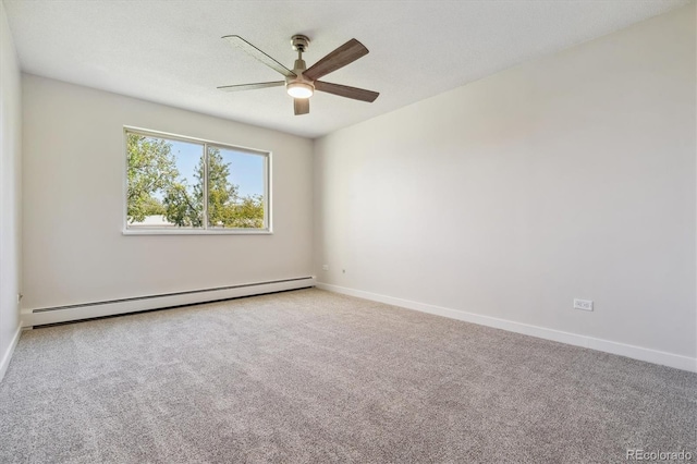 spare room with ceiling fan, a baseboard heating unit, carpet floors, and a textured ceiling