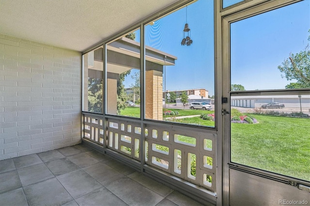 unfurnished sunroom with a healthy amount of sunlight