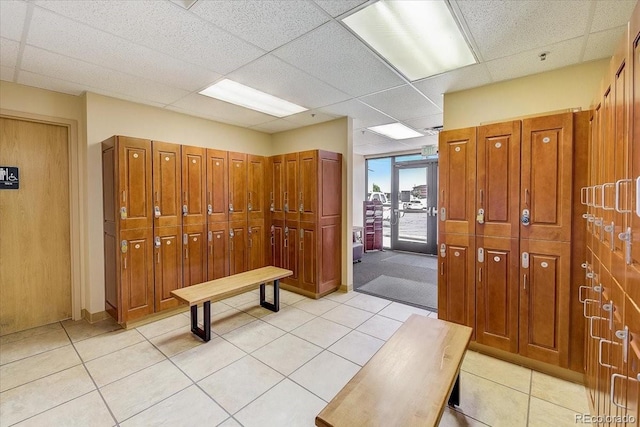 mudroom featuring light tile patterned floors and a paneled ceiling