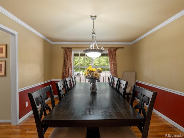 8953 W Brandt Pl, Littleton, CO 80123 - dining area with wood finished floors and ornamental molding