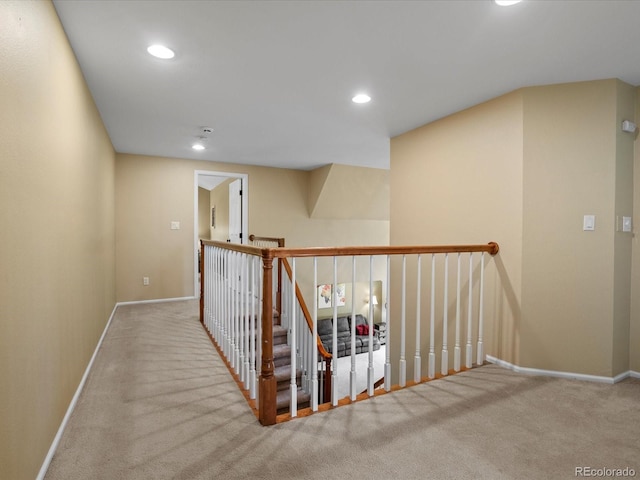 8953 W Brandt Pl, Littleton, CO 80123 - hallway featuring carpet flooring, recessed lighting, and an upstairs landing