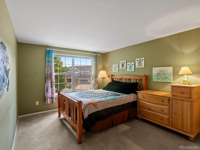 8953 W Brandt Pl, Littleton, CO 80123 - carpeted bedroom featuring baseboards