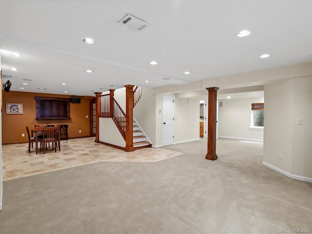 8953 W Brandt Pl, Littleton, CO 80123 - unfurnished living room featuring light colored carpet, recessed lighting, and stairs