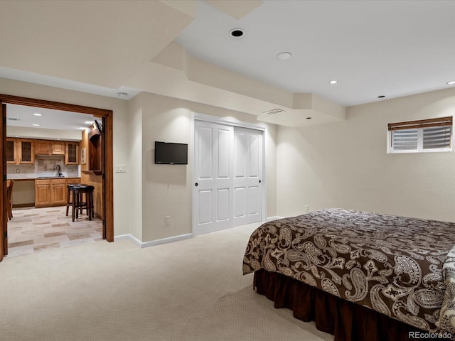 8953 W Brandt Pl, Littleton, CO 80123 - bedroom featuring light colored carpet, recessed lighting, and a closet