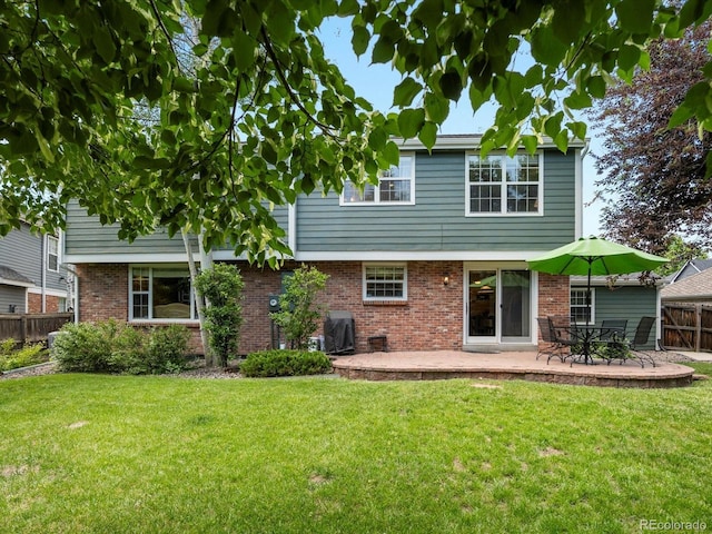 8953 W Brandt Pl, Littleton, CO 80123 - rear view of property with a patio and brick siding
