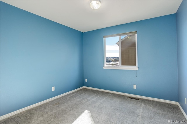 view of carpeted spare room