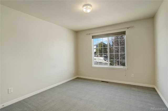 unfurnished room featuring carpet floors