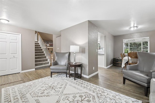 6514 Zinnia St, Arvada, CO 80004 - sitting room featuring wood finished floors and stairway