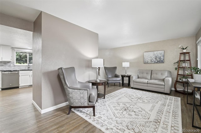 6514 Zinnia St, Arvada, CO 80004 - living area featuring light wood finished floors and baseboards