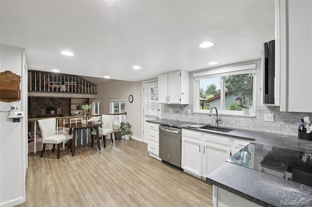 6514 Zinnia St, Arvada, CO 80004 - kitchen with dishwasher, dark countertops, backsplash, light wood-type flooring, and recessed lighting