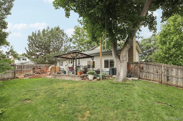 6514 Zinnia St, Arvada, CO 80004 - rear view of property with a fenced backyard, a patio, and a gazebo
