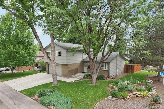 6514 Zinnia St, Arvada, CO 80004 - tri-level home featuring brick siding, concrete driveway, an attached garage, and roof with shingles