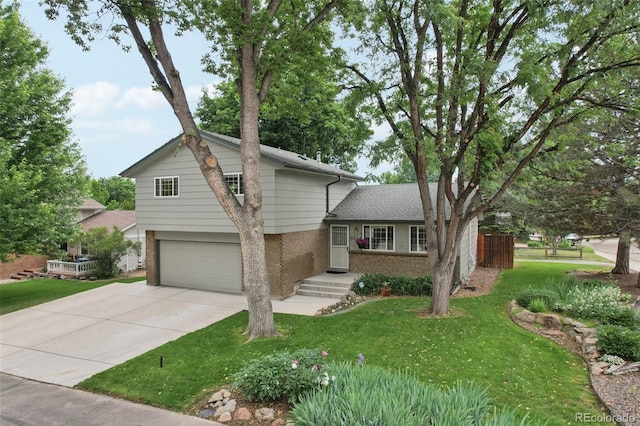 6514 Zinnia St, Arvada, CO 80004 - tri-level home with brick siding, a garage, a front lawn, and driveway