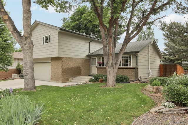 6514 Zinnia St, Arvada, CO 80004 - split level home featuring brick siding, driveway, and an attached garage