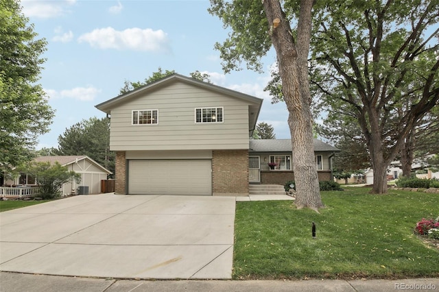 6514 Zinnia St, Arvada, CO 80004 - tri-level home featuring brick siding, an attached garage, concrete driveway, and a front lawn