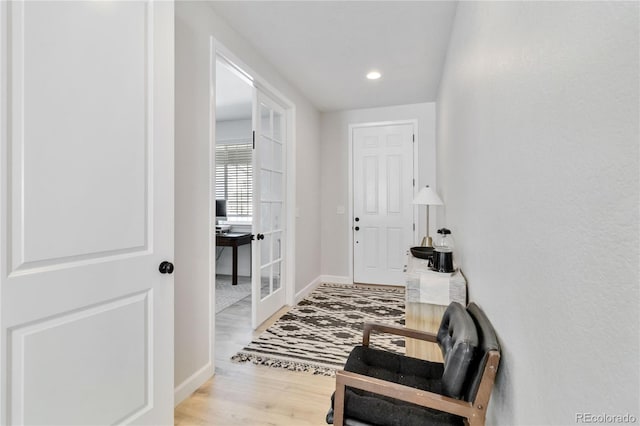 corridor featuring light hardwood / wood-style floors