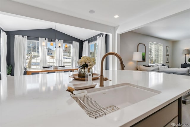 details with sink, hanging light fixtures, stainless steel dishwasher, and a chandelier