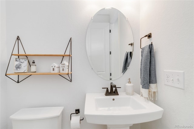 bathroom with toilet and sink