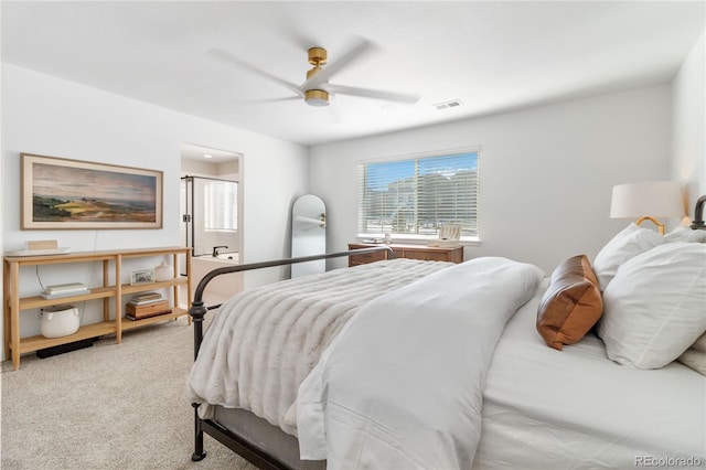 bedroom with ceiling fan and carpet flooring