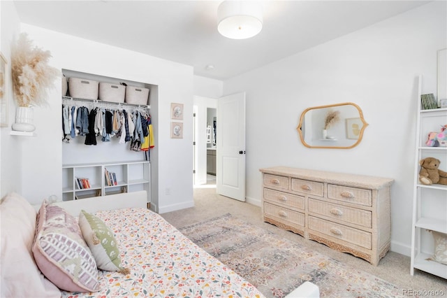 carpeted bedroom with a closet