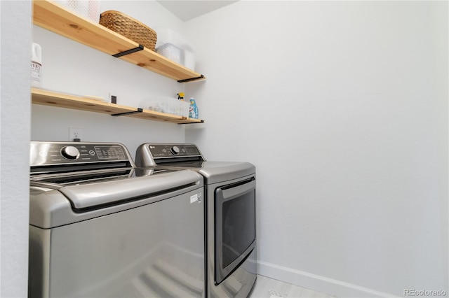 washroom with washer and dryer