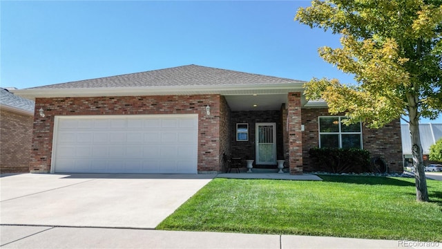 view of front of home featuring a garage and a front lawn