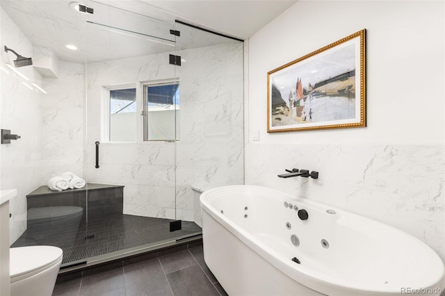 bathroom with tile patterned flooring, separate shower and tub, tile walls, and toilet