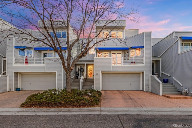 view of front of house with a balcony and a garage