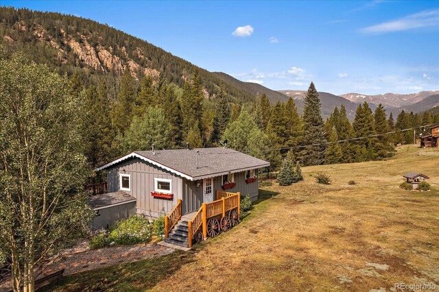 3938 County Road 60, Grant, CO 80448 - view of mountain background featuring a heavily wooded area