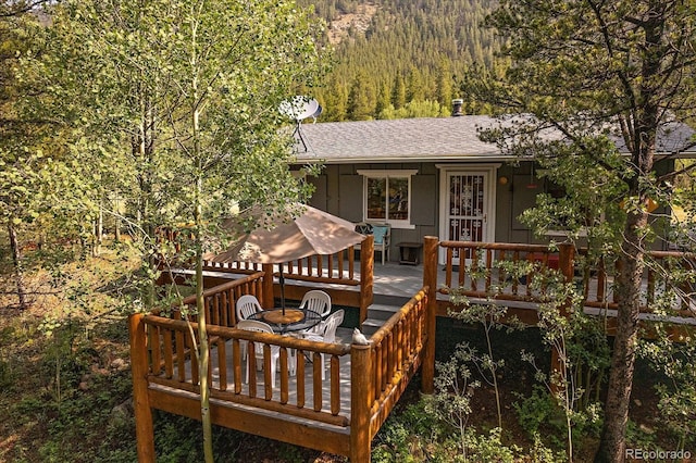 3938 County Road 60, Grant, CO 80448 - wooden terrace featuring a forest view