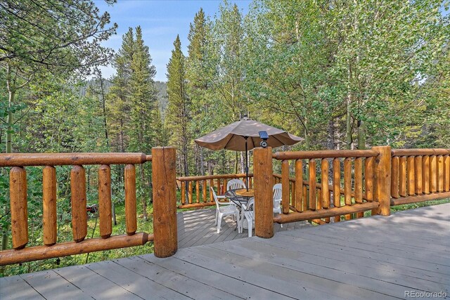 3938 County Road 60, Grant, CO 80448 - wooden terrace featuring a forest view