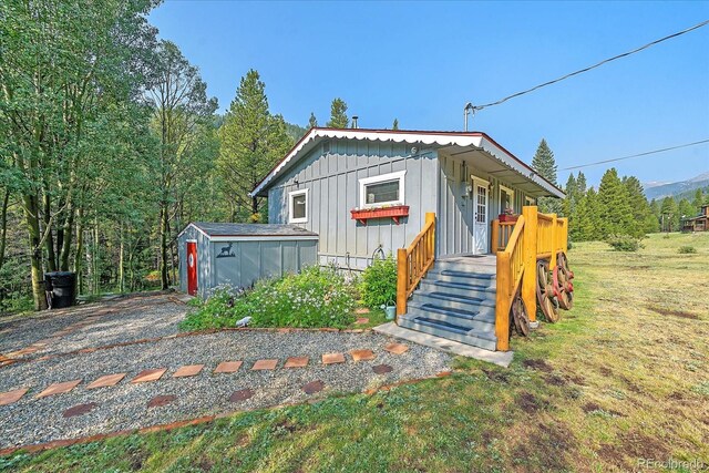 3938 County Road 60, Grant, CO 80448 - view of front facade with board and batten siding