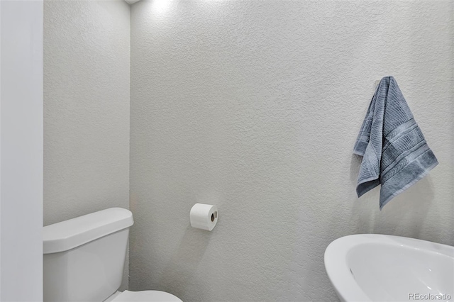 bathroom featuring toilet