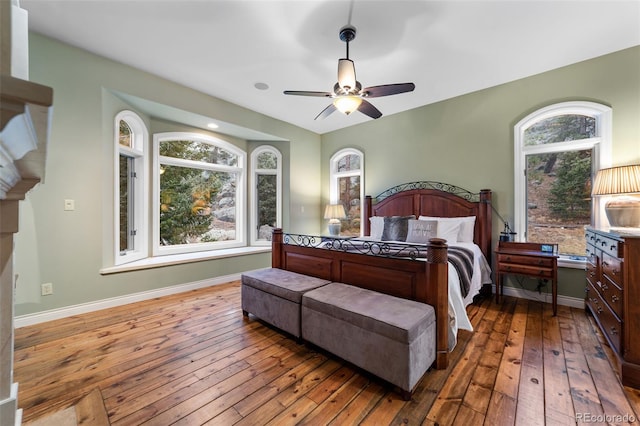 bedroom with ceiling fan and hardwood / wood-style floors