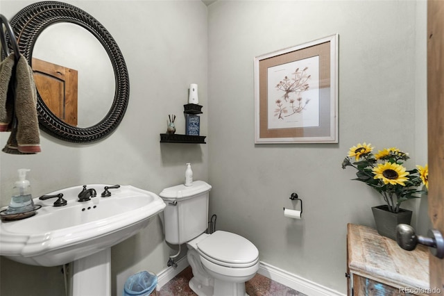 bathroom featuring toilet and sink