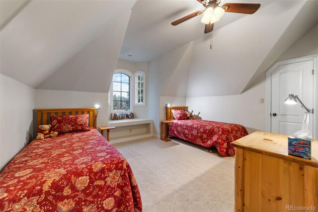 bedroom with vaulted ceiling, light carpet, and ceiling fan