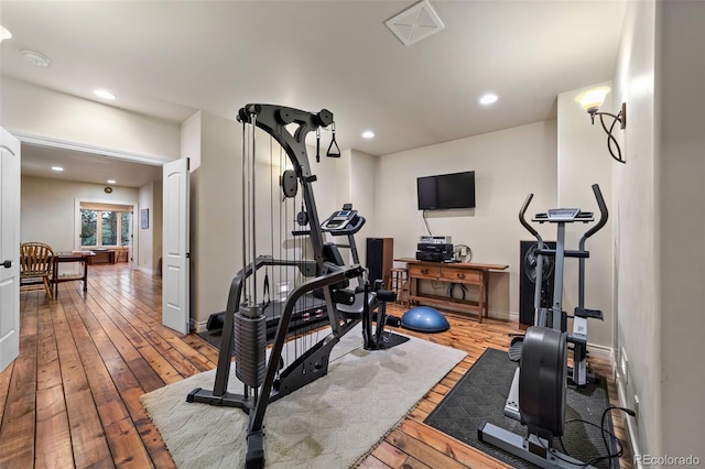 exercise room featuring hardwood / wood-style flooring