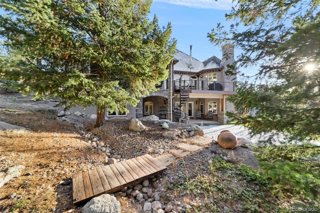 rear view of property with a patio area