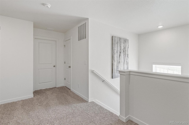 hallway with carpet