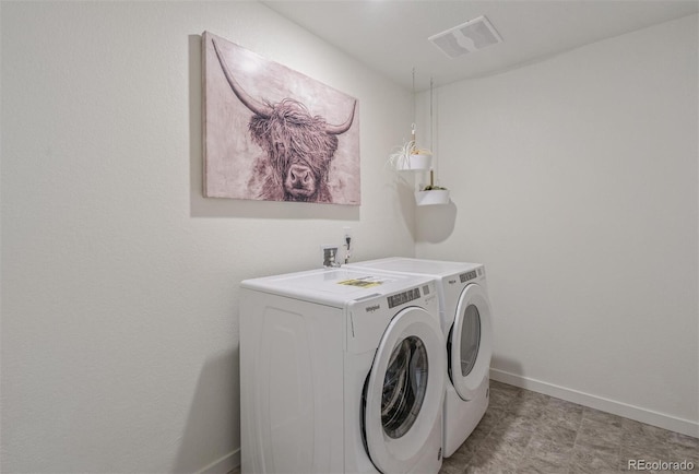 laundry area with independent washer and dryer