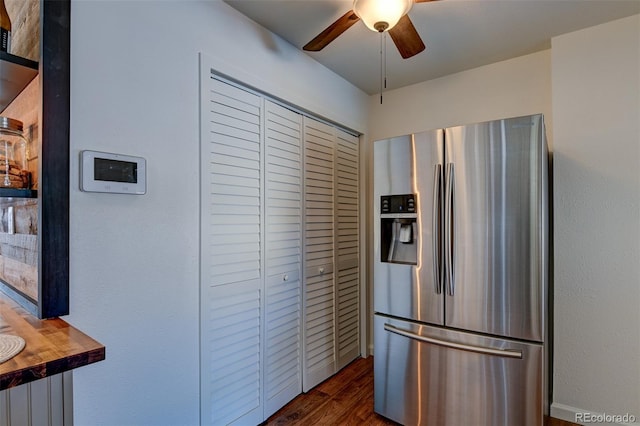 kitchen featuring stainless steel refrigerator with ice dispenser, dark hardwood / wood-style floors, wooden counters, and ceiling fan