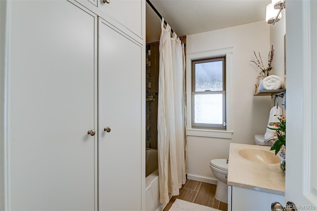 full bathroom featuring vanity, wood-type flooring, shower / bath combo, and toilet