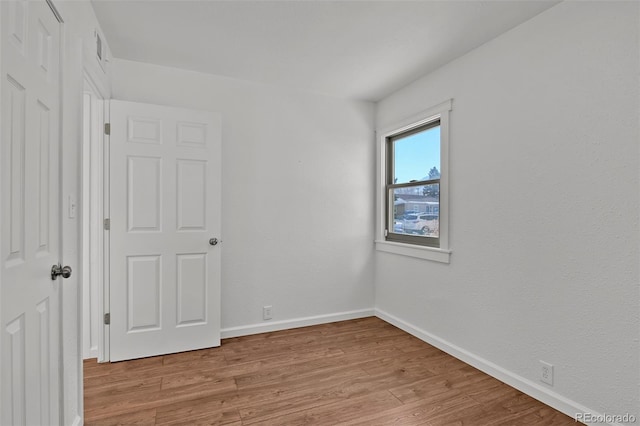 unfurnished room featuring light hardwood / wood-style flooring