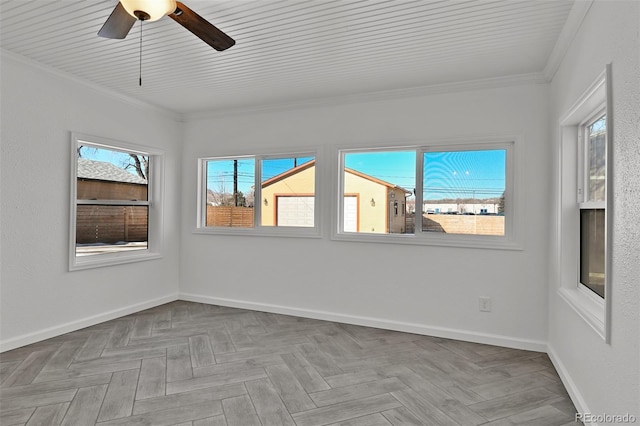 empty room with light parquet flooring and crown molding