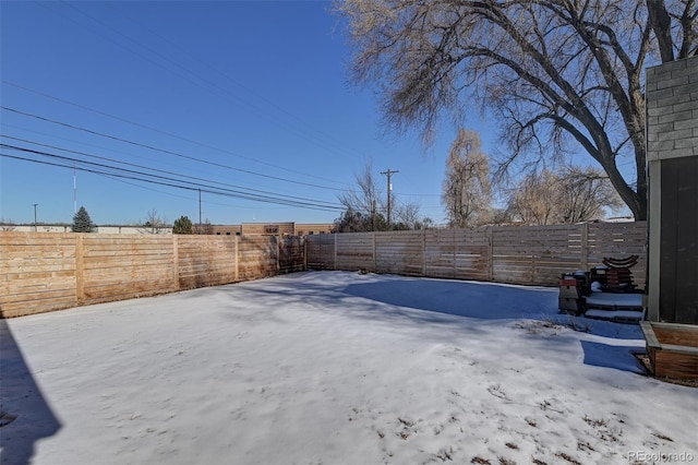 view of yard covered in snow