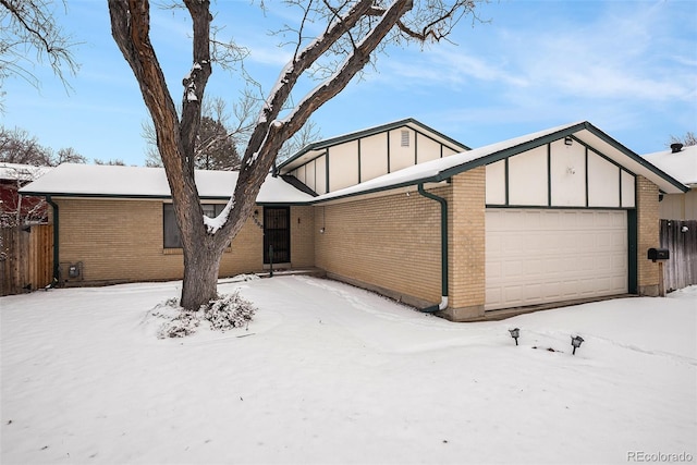 ranch-style home featuring a garage